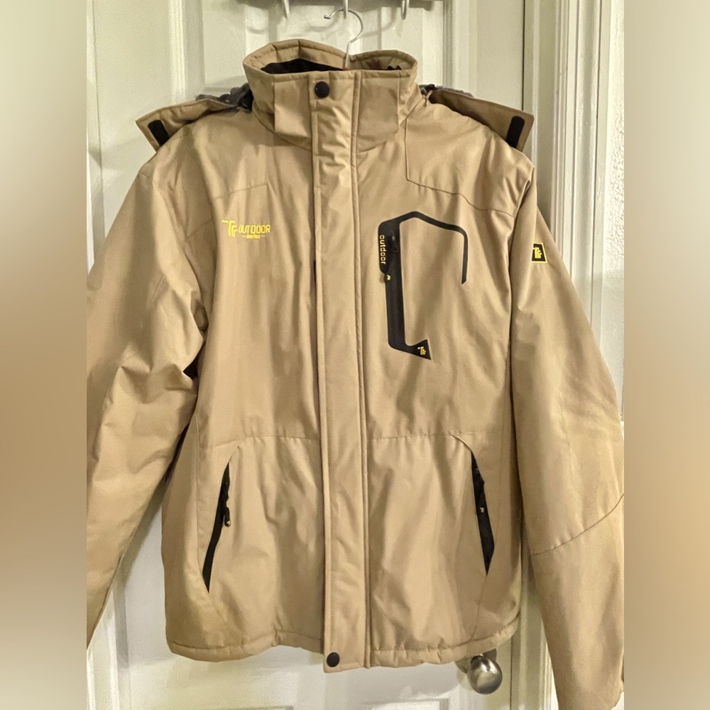 Men’s barely worn Coat Size Medium, with Hood lined with soft faux fur.